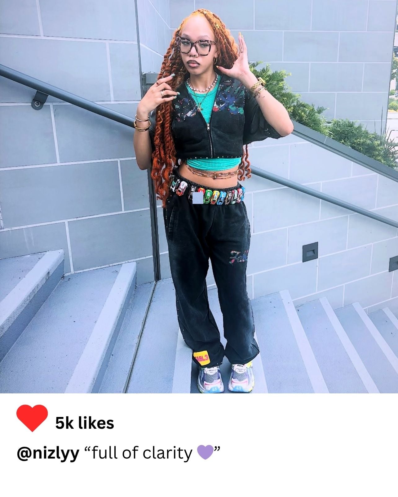 Fashion blogger in grey FABL3 hoodie styled with viral hot wheels car belt