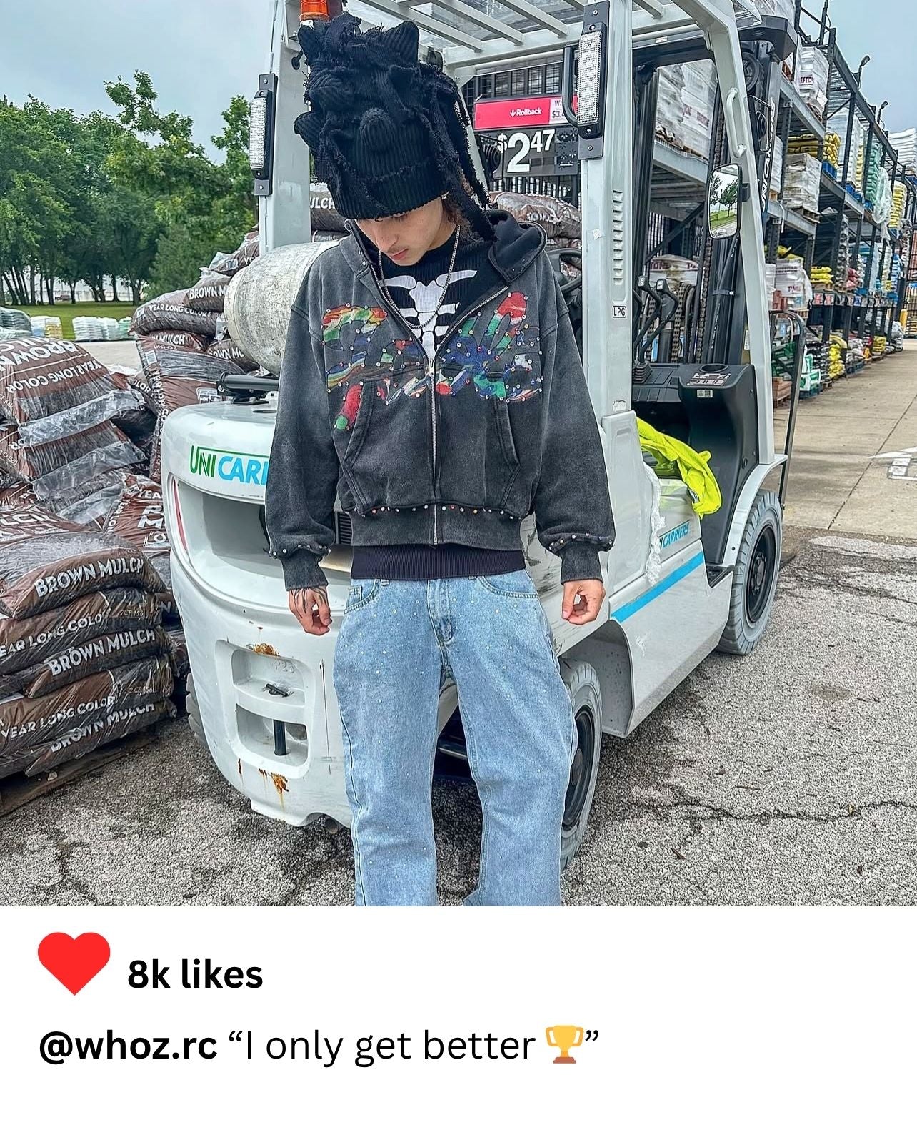 Fashion blogger in grey FABL3 hoodie styled with distressed denim